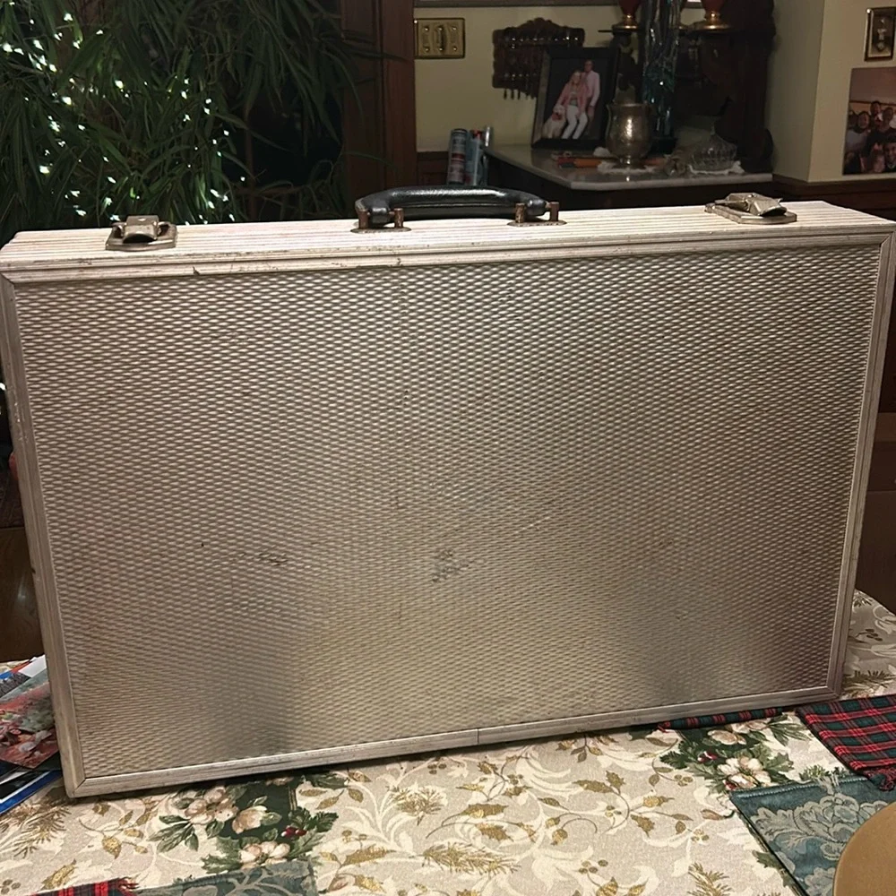 Aluminum padded case, handy for carrying anything; 24”long, 13.5”wide 4” deep
